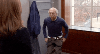 Larry David slowly, nervously removing his pants.